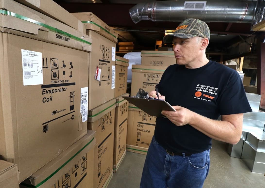 Quality Comfort technician checking inventory