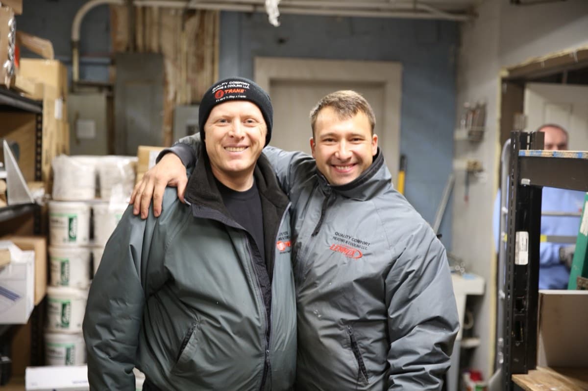Quality Comfort team members in the warehouse